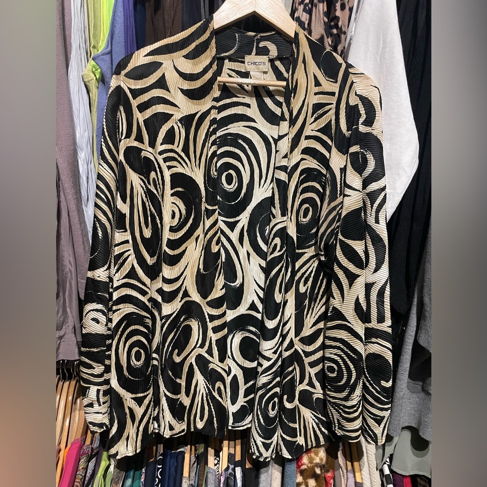 “Chico’s” unique print polyester jacket. Size 2 in Chico’s size.